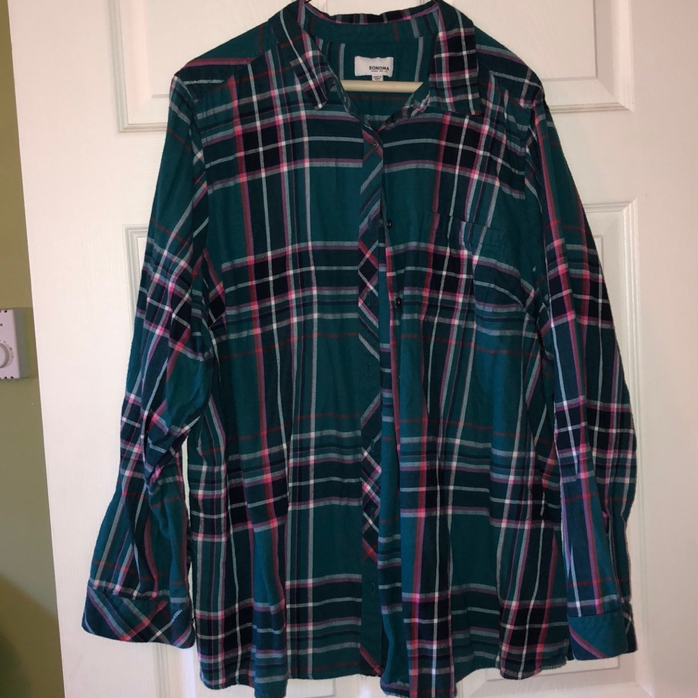 Dark teal/pink plaid flannel shirt.